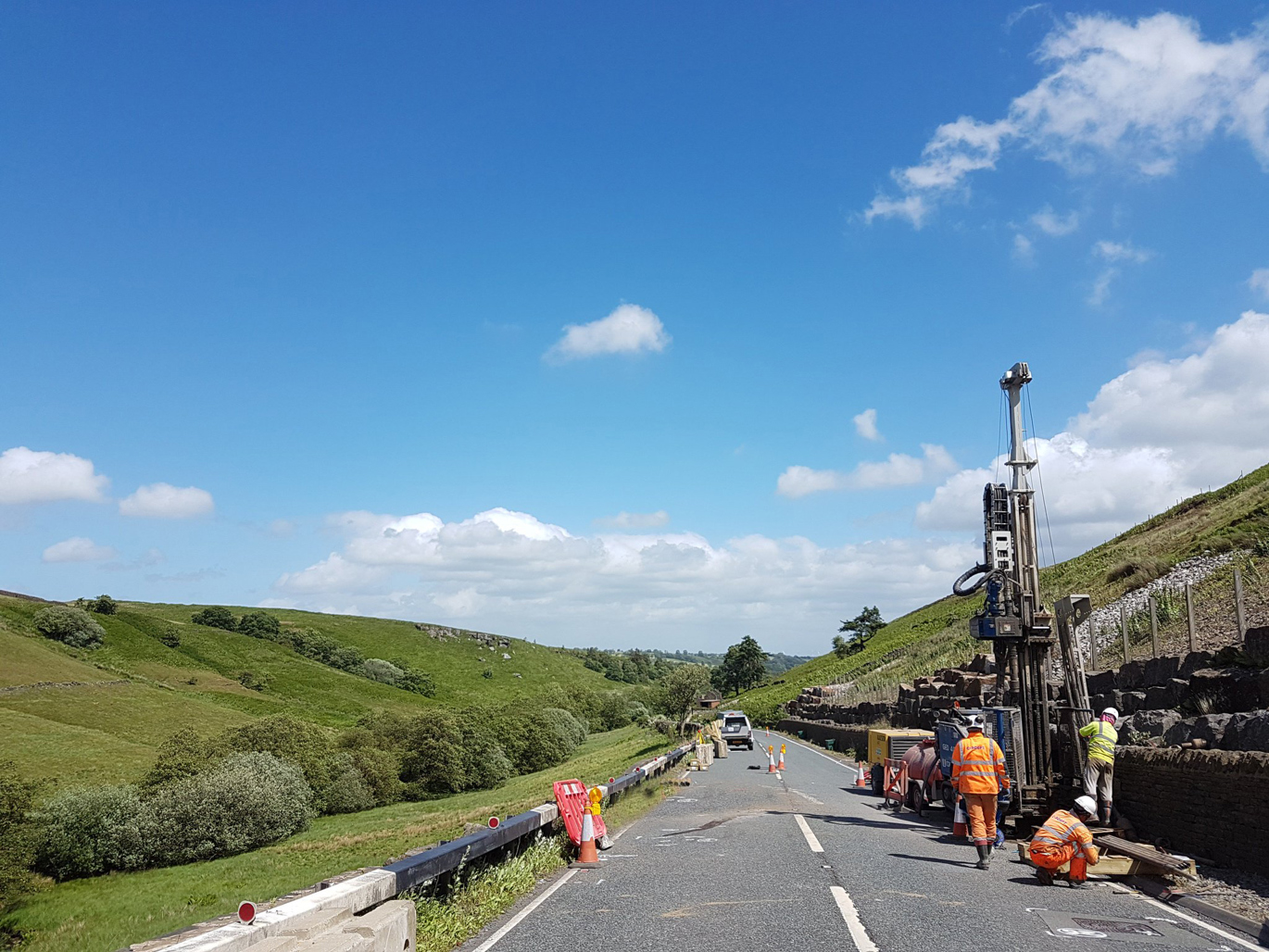 Rotary rig set up on the side of a country road drilling a borehole